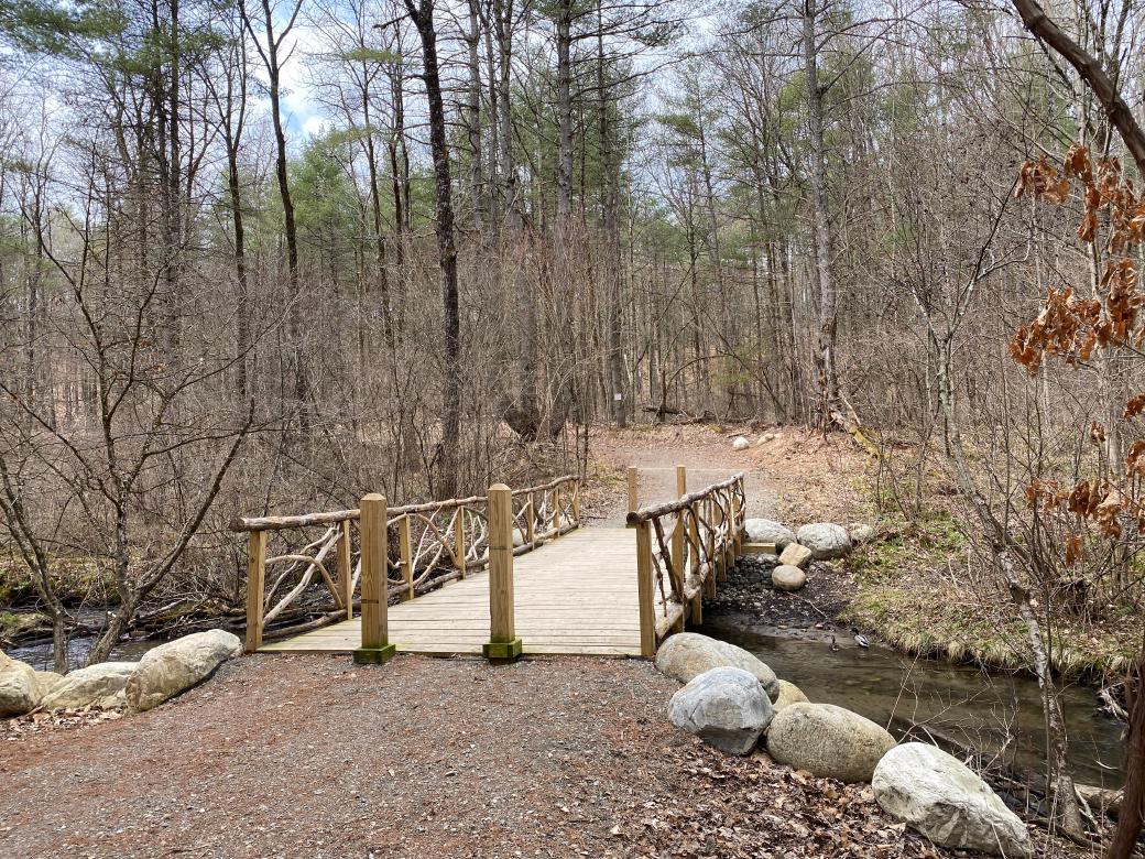 A picture of a wooden bridge over Halfway Brook.
