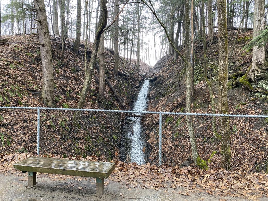 A picture of a waterfall cascading down exposed shale.